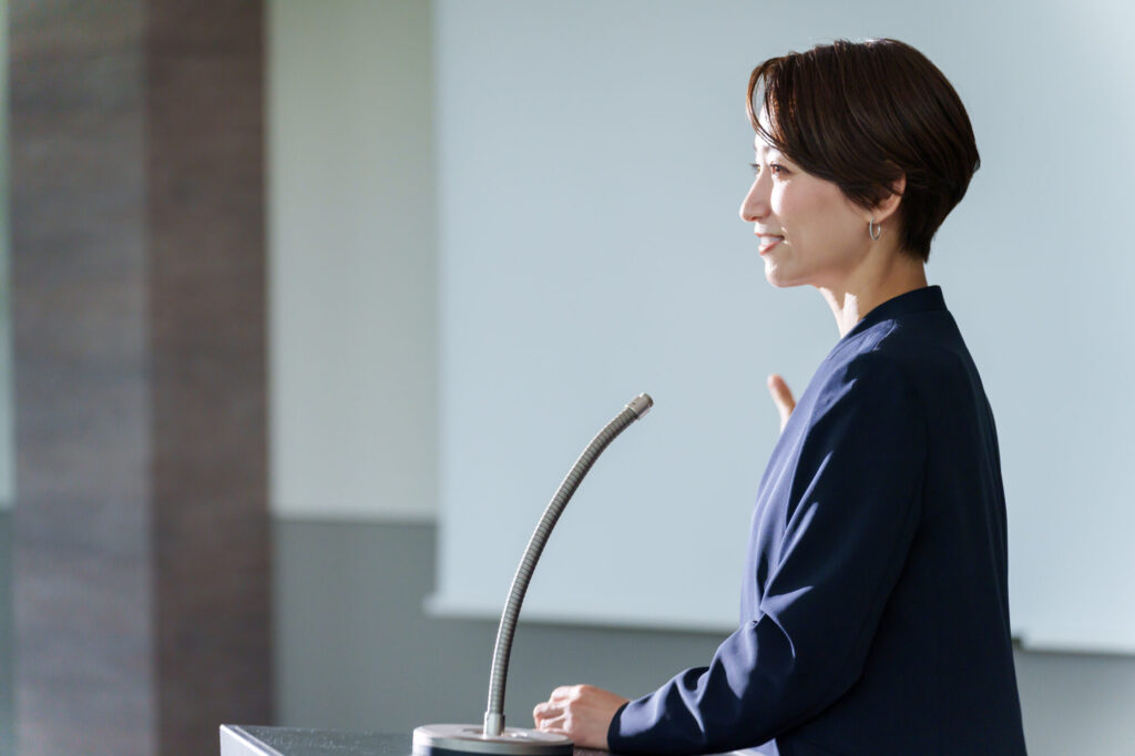 An instructor speaking to an audience